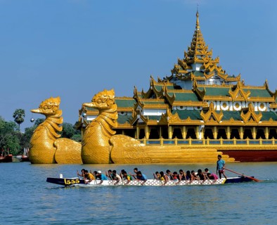 Dragon boat on Lake Kandawgyi in front of the Karaweik ship restaurant