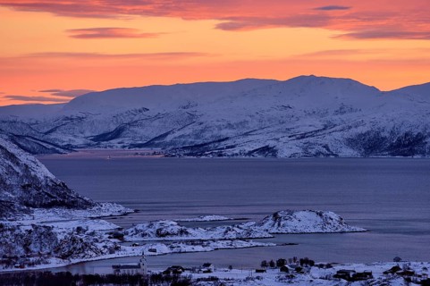 Fjord with islands in winter at sunset