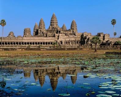 Temple of Angkor Wat reflected in a lotus pond