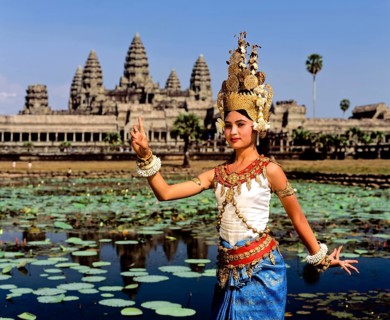 Temple dancer or apsara at the Lotus Pond in front of the temple of Angkor Wat