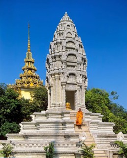 Monk on the stairs at the Kantha Bopha Stupa at the Silver Pagoda