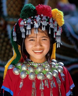 Lisu girl wearing a colourful headdress and the traditional costume of the mountain people