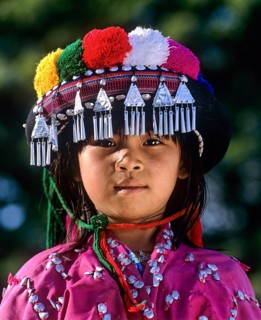 Lisu girl wearing a colourful headdress and the traditional costume of the mountain people