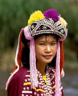Lisu girl wearing a colourful headdress and the traditional costume of the mountain people