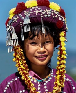 Lisu girl wearing a colourful headdress and the traditional costume of the mountain people