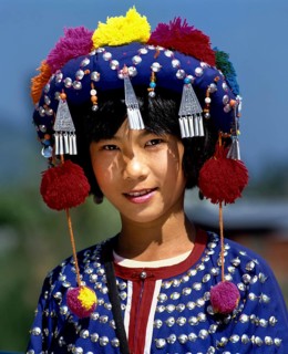 Lisu girl wearing a colourful headdress and the traditional costume of the mountain people