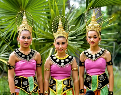 Three young women wearing traditional costumes