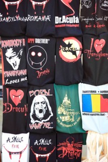 T-shirts with Dracula and vampire designs in a souvenir shop