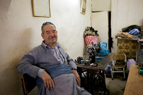 Tailor in a tailor store