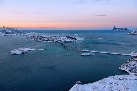 Fjord with islands and a bridge during the blue hour
