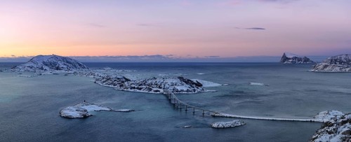 Fjord with islands and a bridge during the blue hour