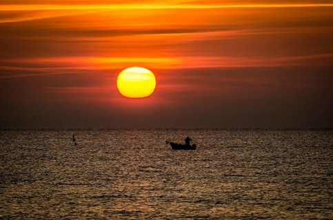 Fishing boat at sunrise