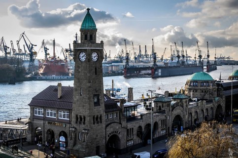 Water level tower of St. Pauli Landing Bridges in front of the Blohm + Voss shipyard with cranes