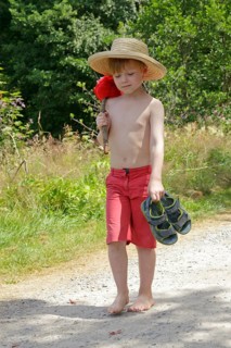 Boy with stick and hat