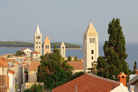 Four church steeples above the roofs of the historic town centre