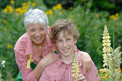 Grandmother and grandson in a garden