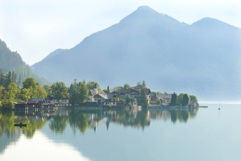 Walchensee on Lake Walchen with a fishing boat
