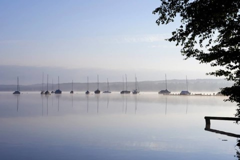 Lake Starnberg with sailing boats in the morning