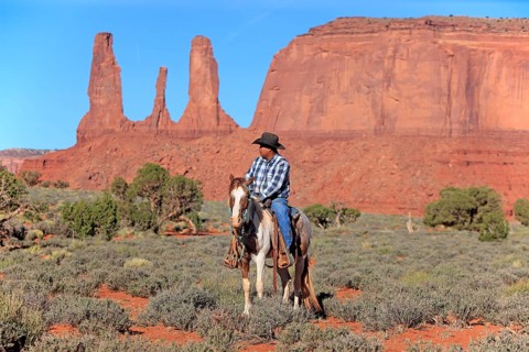 Navajo cowboy riding on a Mustang