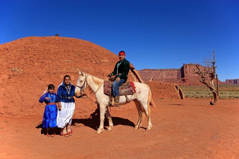 Navajo Indian family with a horse