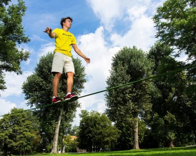 Young man balancing on a slackline