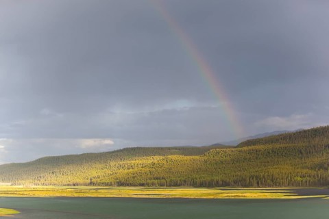 Heavy clouds and rainbow over Marsh Lake