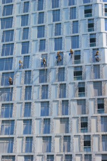 Window cleaners working on the facade of a skyscraper