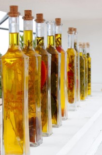 Bottles with olive oil and herbs