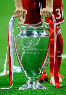 Bastian Schweinsteiger leaning on the trophy