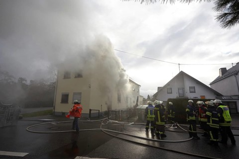 Firefighters fighting a house fire