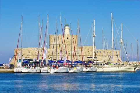 Sailing ships in front of the fortified tower of Agios Nikolaos
