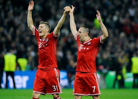 Bastian Schweinsteiger and Franck Ribery cheering jubilantly at the end of the game