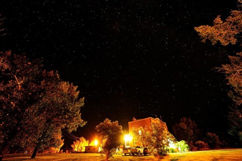 Starry sky over a small village in the middle of the prairies