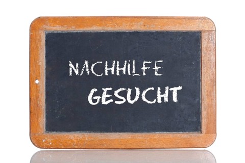 Old school blackboard with the words NACHHILFE GESUCHT