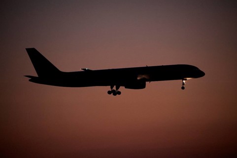 Aircraft approaching Dalaman Airport at dusk