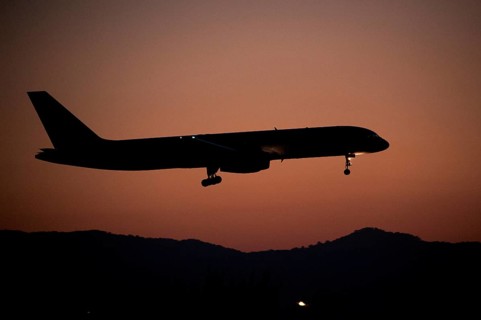 Aircraft approaching Dalaman Airport at dusk
