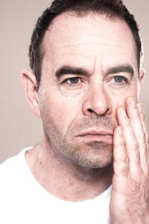 Man with markings for plastic surgery under his eye