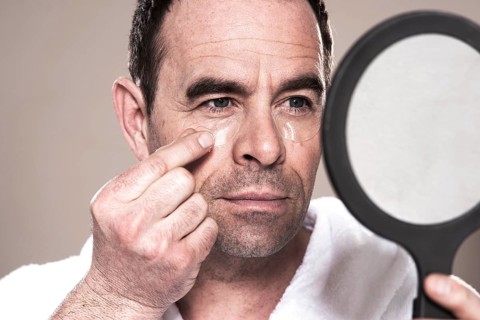 Man applying eye pads