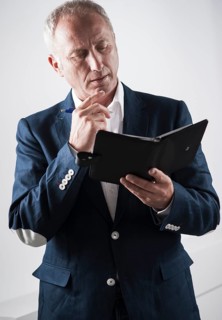 Businessman holding an appointment calendar
