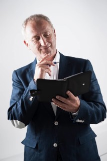 Businessman holding an appointment calendar