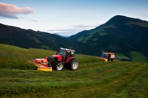 Tractor mowing hay