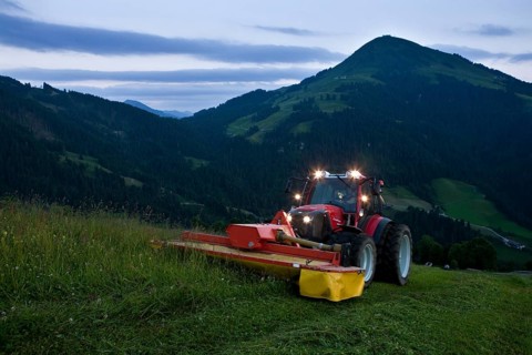 Tractor mowing hay