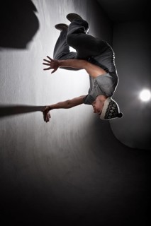 Freerunner jumping and turning off a wall