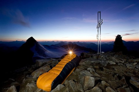 Mountain climber sleeping on the summit of Wilder Pfaff Mountain