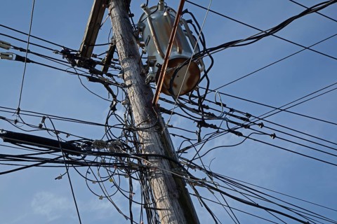 Electrical cables and telephone wires on a power pole