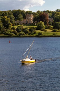 Sailboat on Lake Glienicke in front of Schloss Babelsberg Castle