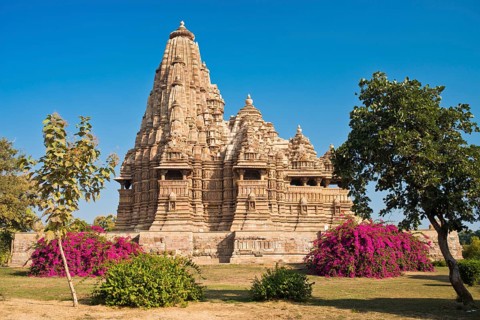 Hindu temple with flowering bougainvillea bushes