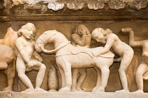 Relief on the outside the Lakshman Temple displaying a sodomist scene of men copulating with a horse