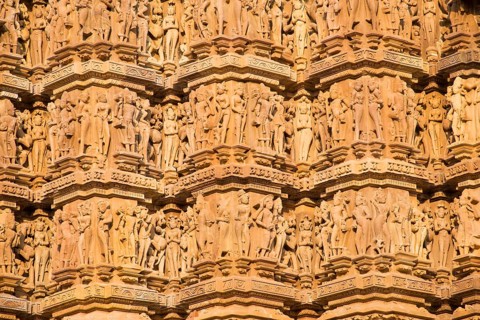 Relief sculptures of gods and men on the facade of the Lakshman Temple
