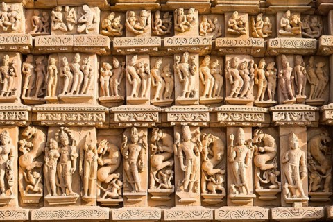 Relief sculptures of gods and men on the facade of the Parshvanath Temple